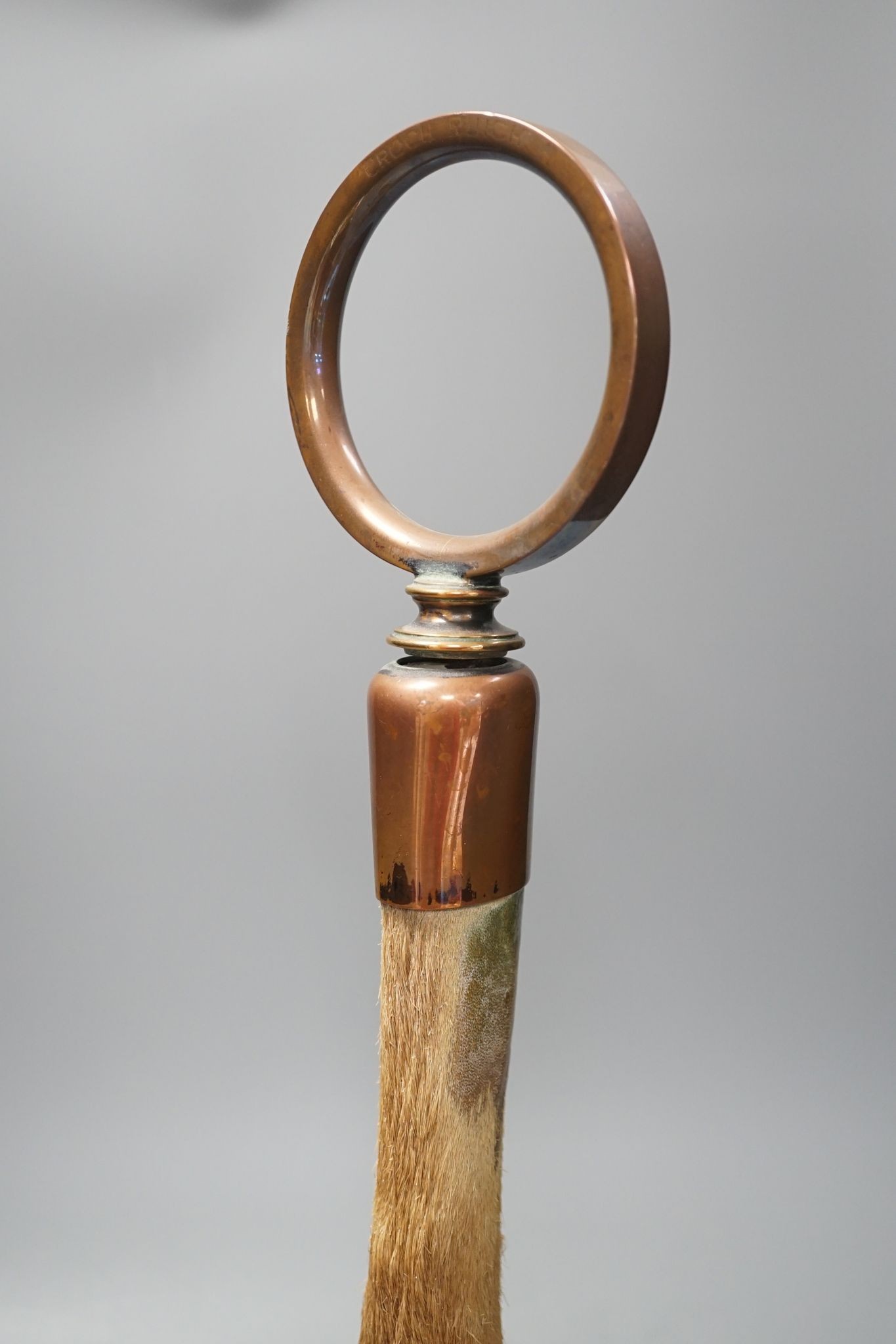 A Victorian taxidermic deer's hoof door-stop with copper cased base 48cm